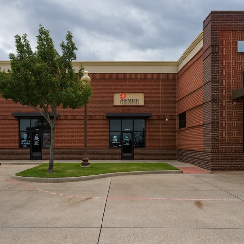 Happy woman holding purple flowers
