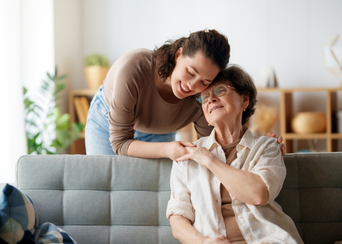 Happy woman holding purple flowers